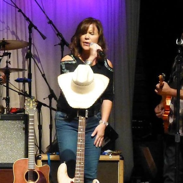 Jennifer Keel Faughn singing at Tim Dooley's memorial