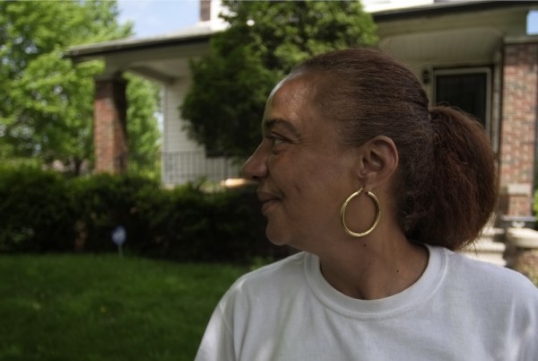 Janet Bunting stands outside her home on Haverhill Street