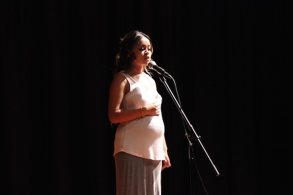 Jocelyn sharing a poem at KGAs Yellow Lounge