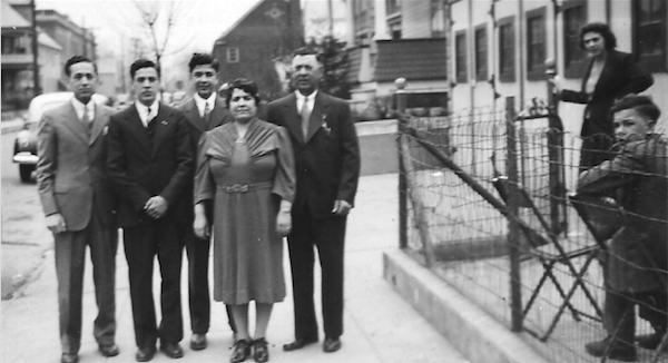 The author’s father (third from the left), standing behind his mother and with other members of his family in 1941.