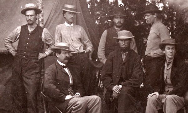Thomas T. Eckert, seated left, with six telegraph assistants near Petersburg, Virginia, 1864. From James E. Taylor Collection: Scrapbook Two.