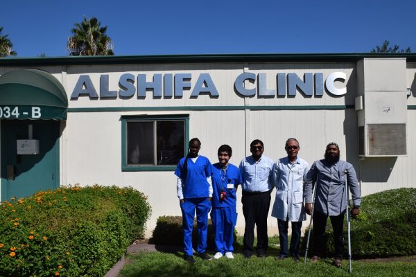 Staff and volunteers outside the Al-Shifa Clinic. 