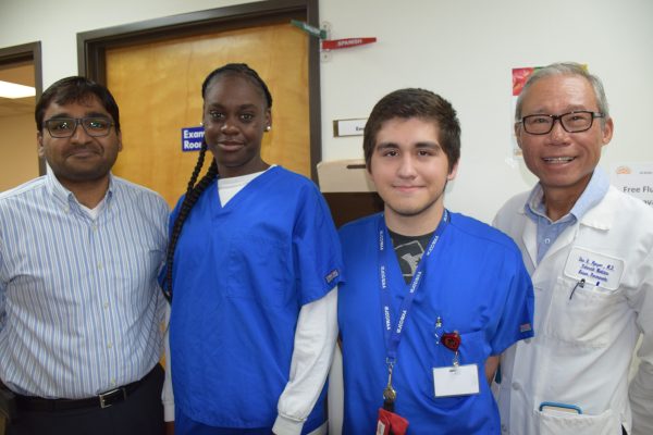 From left to right: Al-Shifa manager Muhammad Safwatullah, Job Corps interns Keviana Mims and Alex Acuna, and Dr. Duc Nguyen at Al-Shifa Free Health Clinic.