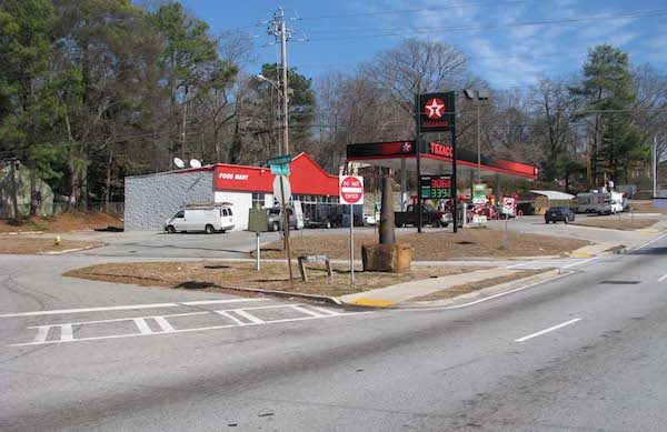 The Walker Monument, orange and next to the Texaco star, sits on Glenwood Avenue where General Walker fell at the westbound entrance ramp to I-20. Photo by Henry Bryant.