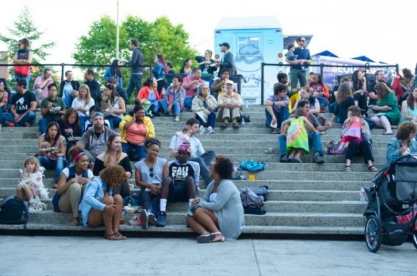 Vistors enjoy “Friday Nights @ OMCA,” a program of the Oakland Museum of California, during the exhibition “All Power to the People: Black Panthers at 50.” Photo courtesy of the Oakland Museum of California.